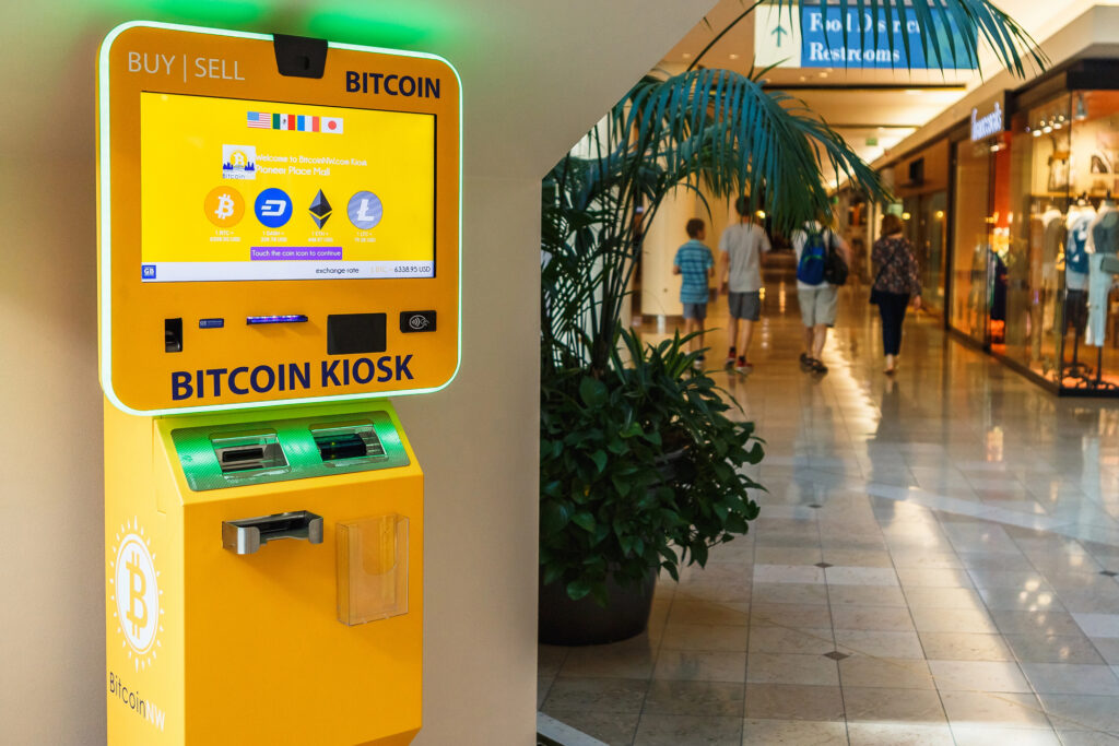 Bitcoin kiosk in a shopping mall showing where and how to buy Bitcoins with cash using an ATM