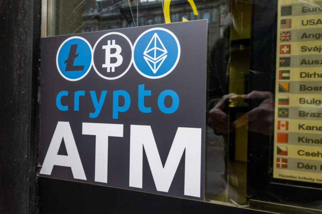 Crypto ATM sign showing that you can buy Bitcoins with cash using a cryptocurrency kiosk
