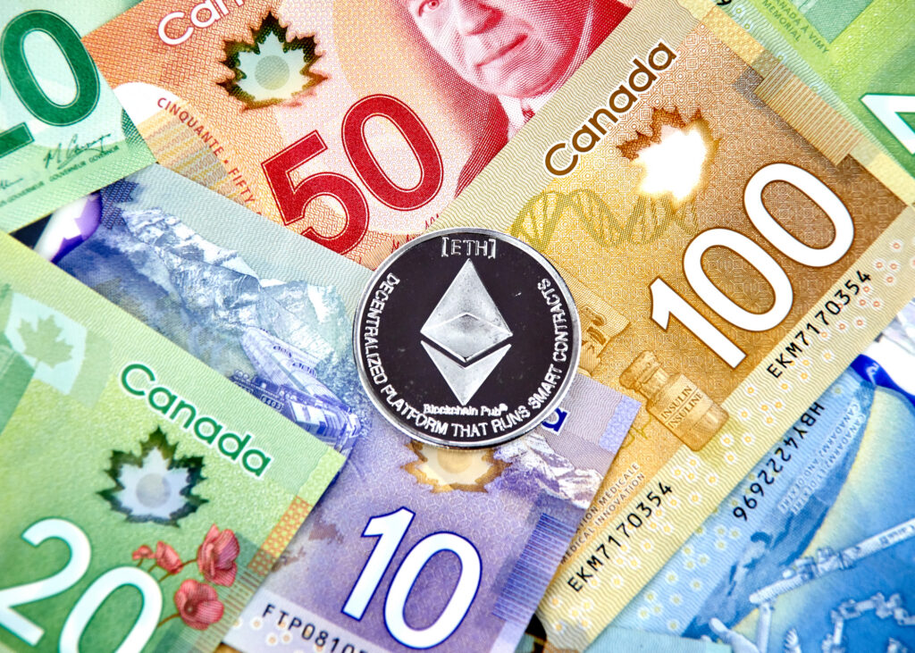 Ethereum coin placed on Canadian dollar bills, illustrating how to buy Ethereum with cash in Canada.