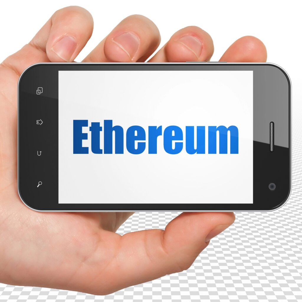 Smartphone displaying the word Ethereum, symbolizing how to buy Ethereum using a mobile wallet in Canada.