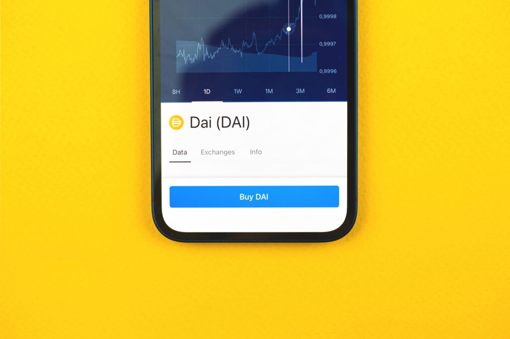 DAI stablecoin displayed on mobile app with price chart and buy option